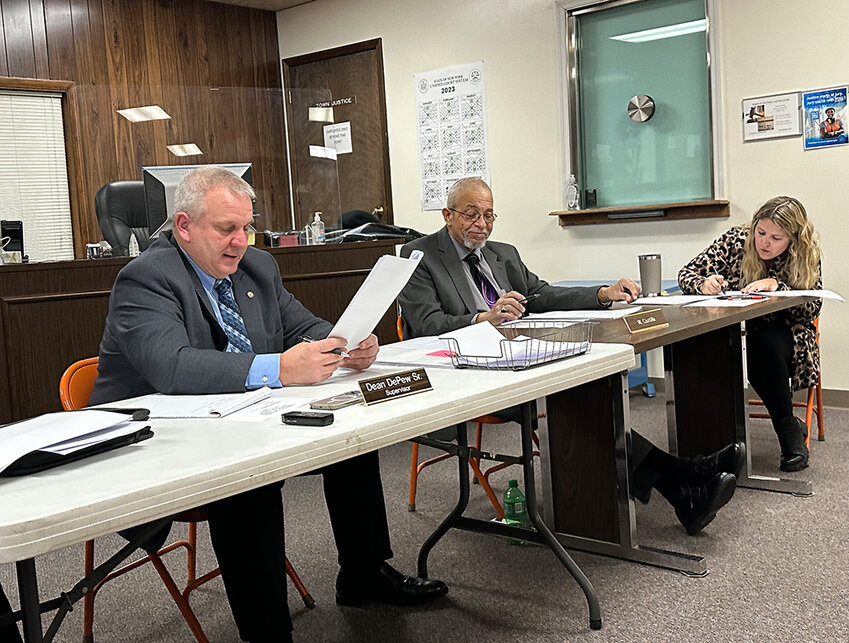Supervisor Dean DePew Sr. reads appointments during the Town of Plattekill&rsquo;s reorganizational meeting on January 3. He appointed Wilfrido Castillo Jr. (center) as Deputy Supervisor. Town Clerk Sarah Nelson (right) records the minutes.