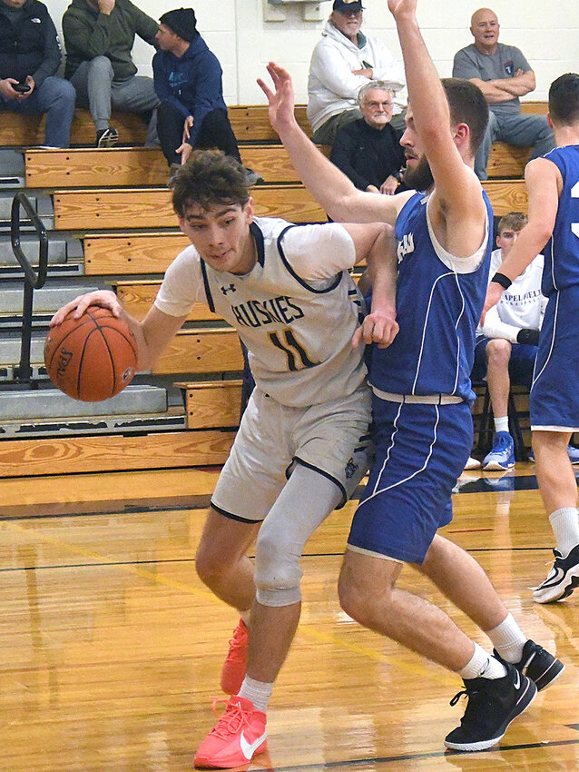 Highland&rsquo;s Reid Berean drives past Chapel Field&rsquo;s Mikey Bonagura during Wednesday&rsquo;s non-league boys&rsquo; basketball game at Highland High School.