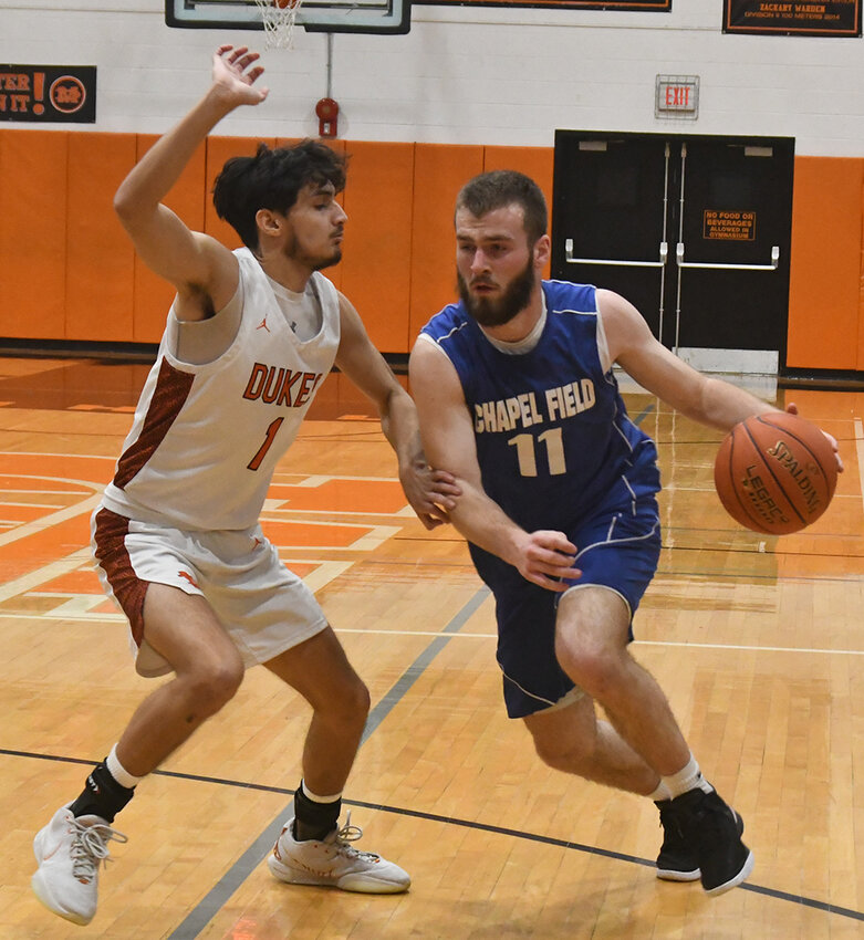 Chapel Field&rsquo;s Mikey Bonagura drives during Wednesday&rsquo;s non-league boys&rsquo; basketball game at Marlboro High School.