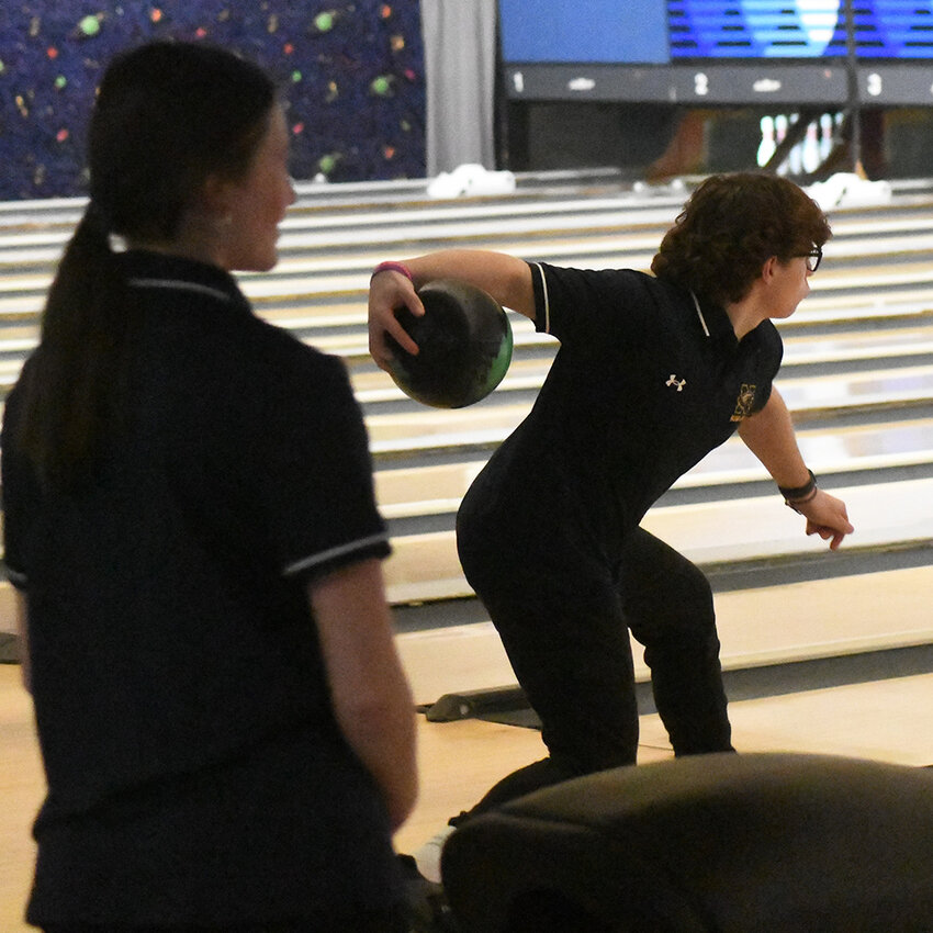 Newburgh’s Stephen Barnes approaches the lane as Gianna Alisandrella prepares to bowl during Thursday’s Division 1 bowling match at Pat Tarsio Lanes in Newburgh.