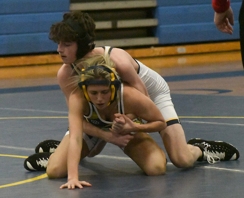 Highland’s Ava Acampora wrestles Our Lady of Lourdes’ Matthew McCarthy during a 124-pound bout at a league wrestling match on Jan. 30 at Our Lady of Lourdes High School in Poughkeepsie.