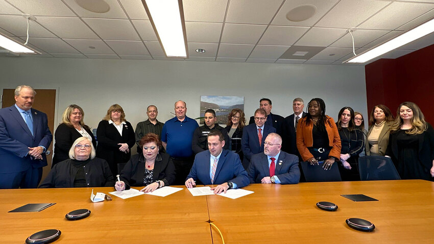 Orange County Executive Steven M. Neuhaus and CSEA Orange County Unit 7900/02 President Denise Fuchs with CSEA members and County employees at the official signing of the new contract.