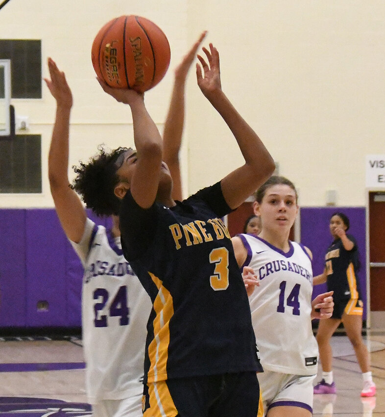 Pine Bush&rsquo;s Leticia Watson goes up for a shot as Monroe-Woodbury&rsquo;s Brianna Taveras defends and Sienna Feely pursues during Wednesday&rsquo;s OCIAA Division I girls&rsquo; basketball game at Monroe-Woodbury High School in Central Valley.