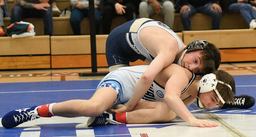 Newburgh’s Cooper Merli controls Wallkill’s Marco Futia during a 108-pound championship bout at Saturday’s Section 9 Division I tournament at Monroe-Woodbury High School in Central Valley.
