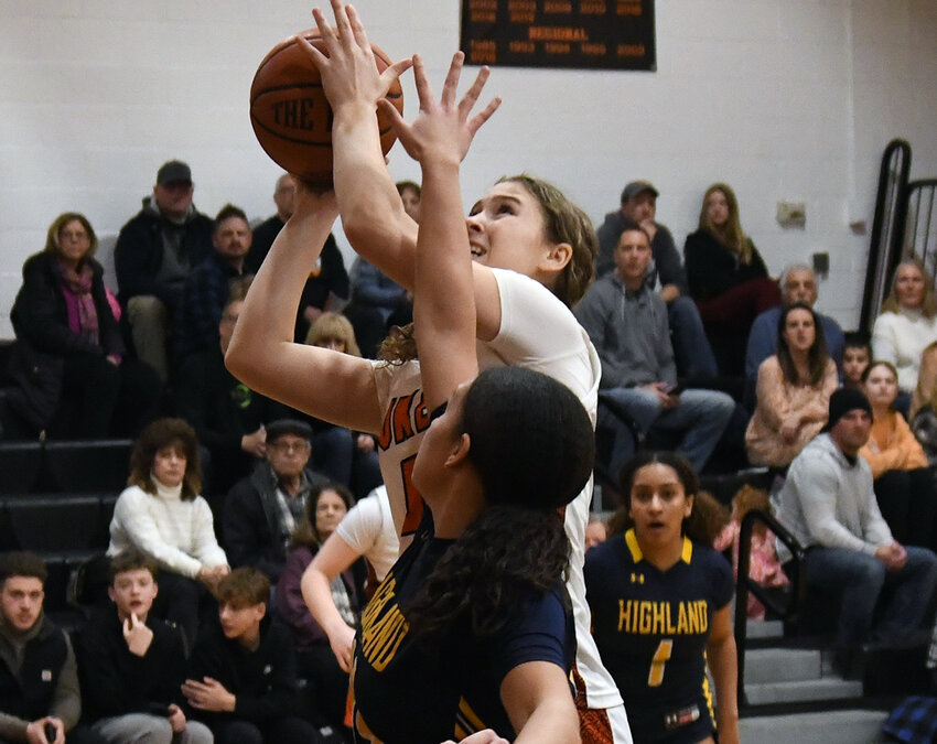 Highland’s Hannah Polumbo goes up for a shot as Highland’s Ciara Teamer defends during Friday’s non-league girls’ basketball game at Marlboro High School.