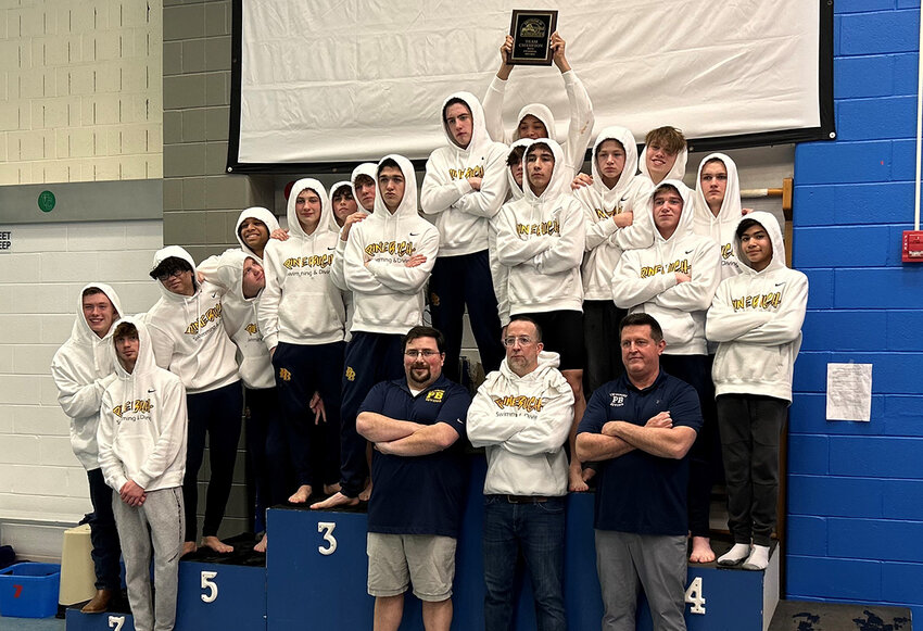 The Pine Bush Bushmen pose with the Section 9 championship plaque after winning the Section 9 boys’ swimming and diving championship meet at Valley Central High School in Montgomery.