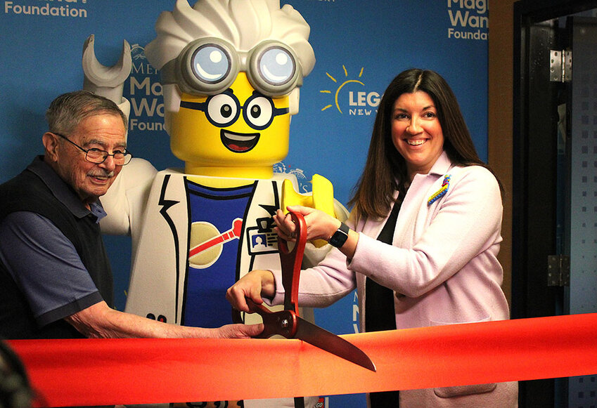 William Kaplan and Stephanie Johnson, Divisional Director at LEGOLAND New York cut the celebratory ribbon officially opening the Merlin&rsquo;s Magic Space with LEGO Themed Classroom.