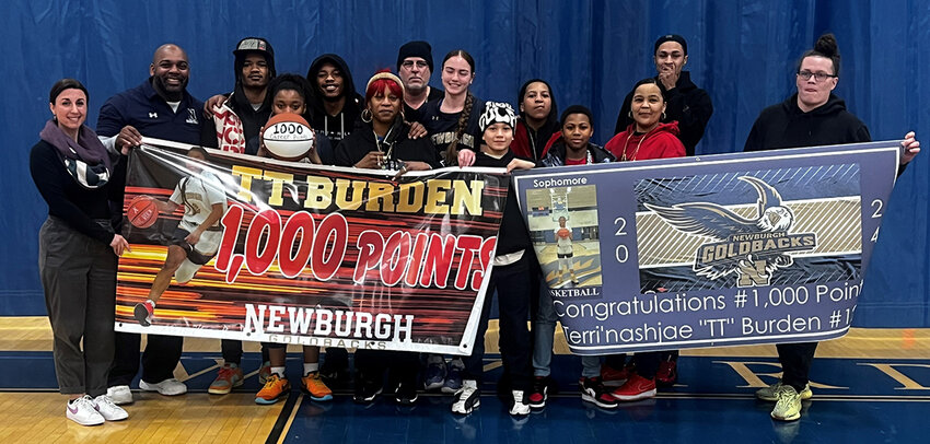 Newburgh&rsquo;s TT Burden is shown with family, friends, teammates and coaches after scoring her 1,000th career point on Feb. 15 at Washingtonville High School.