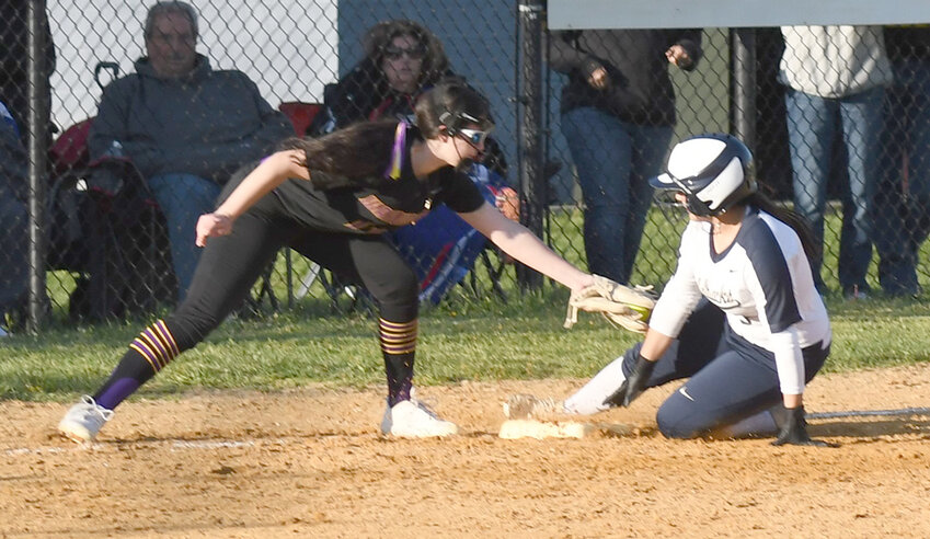 Newburgh’s Madison Gravel slides into third base as Warwick third baseman Katie Fiore is late with the tag during an OCIAA crossover softball game on April 25, 2023.