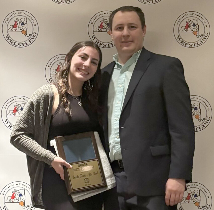 Photo courtesy Patrick Sause
Pine Bush’s Brooke Tarshis is shown after receiving the Section 9 Female Wrestler of the Year Award at the Section 9 Banquet. Pine Bush coach Patrick Sause is at right.