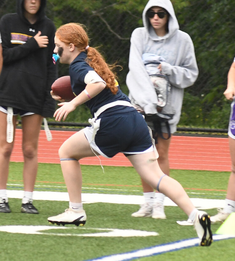 Pine Bush&rsquo;s Ella Cancielliere runs the football during the Section 9  championship flag football game on May 24, 2023, at Goshen High School.