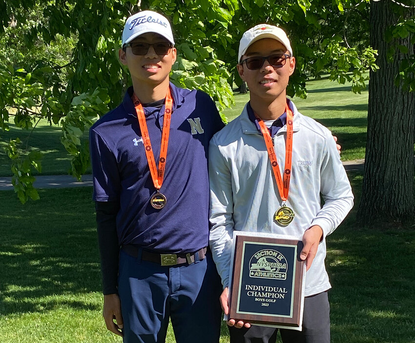 Mark Yan, left, and Josh Yan are shown after the Section 9 boys’ golf championship on May 25, 2023.