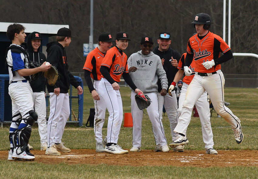 Marlboro’s John Ryder is greeted by his teammates after hitting a home run during Wednesday’s non-league baseball game at Valley Central High School in Montgomery.