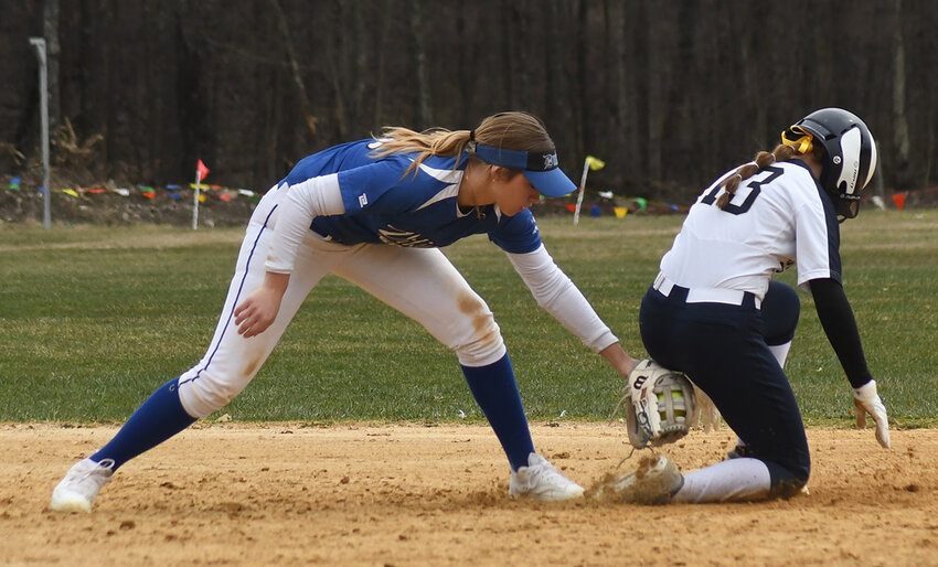 Newburgh’s Parker Mullarkey slides safely into second base as Valley Central’s Emilia Brundage applies the tag late during a non-league softball game on March 26.