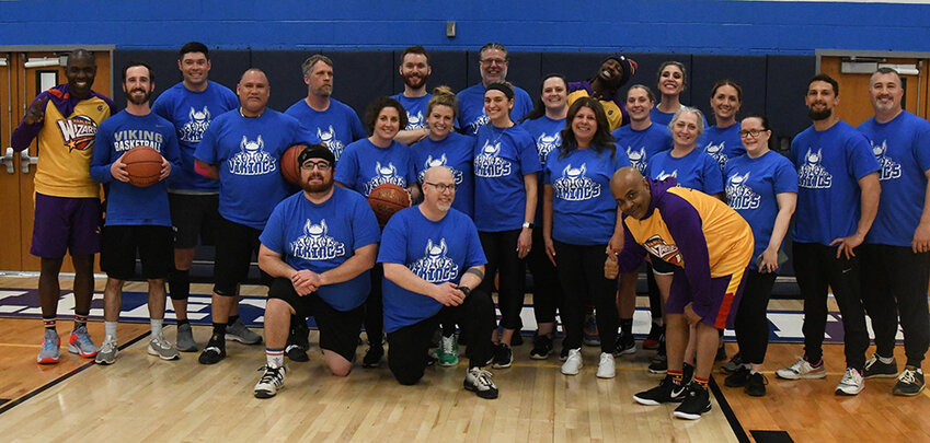 The Valley Central Vikings teachers pose with the Harlem Wizards' &quot;Broadway&quot; Eric Jones, &quot;Loonatik&quot; Lloyd Clinton and &quot;A-Train&quot; Arnold Bernard on April 2 at Valley Central High School in Montgomery.