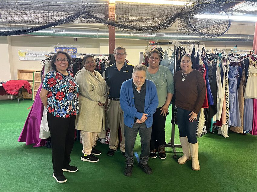 Josephine Bloomfield, Esther Garcia, Aaron Bloomfield, Ed Bloomfield, Doris Rodriguez and Carol Cuevas-Howard (left to right) pose for a photo while preparing for the &ldquo;Free Prom Dresses&rdquo; events at Temple Sinai in Middletown.