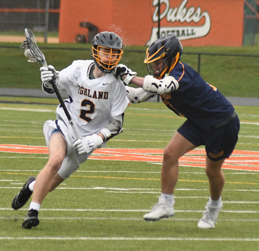 Highland&rsquo;s Eben Yager carries the ball as Pine Bush&rsquo;s Dylan Csanko defends during Thursday&rsquo;s non-league boys&rsquo; lacrosse game at Marlboro High School.