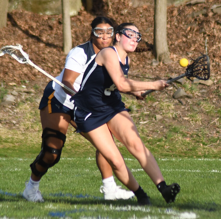 Newburgh&rsquo;s Emily Leonard shoots the ball as Highland&rsquo;s Amelia Delforno defends during a non-league girls&rsquo; lacrosse game on April 9 at Highland Middle School.