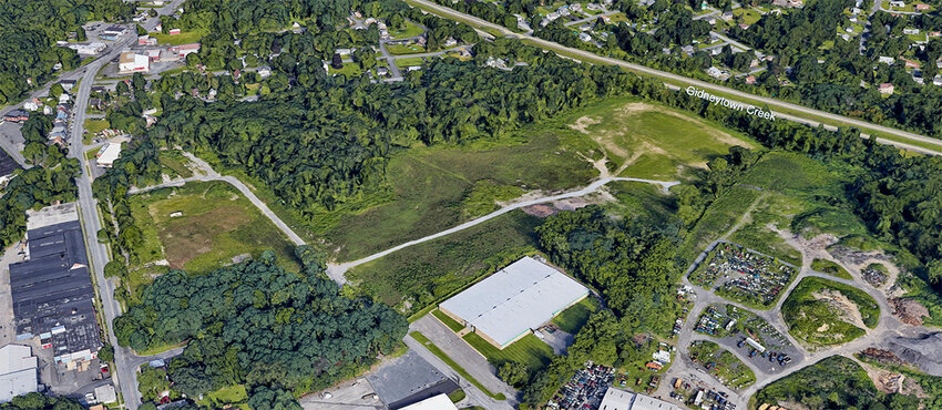 An aerial view of the DuPont-Stauffer Landfill site along South Street proposed as the future location for a new warehouse facility.