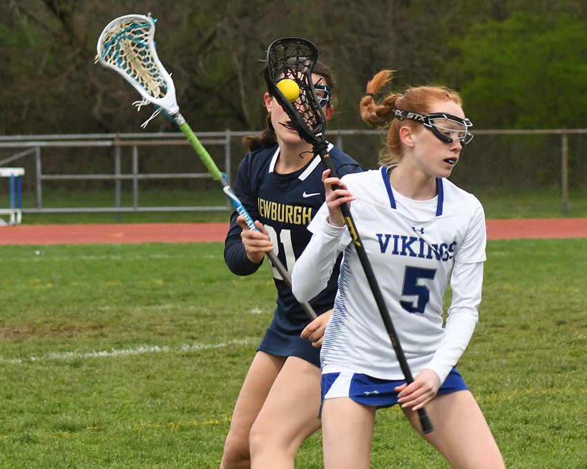 Valley Central’s Molly Hoover carries the ball as Newburgh’s Madison Foti defends during Thursday’s Division I girls’ lacrosse game at Valley Central High School in Montgomery.