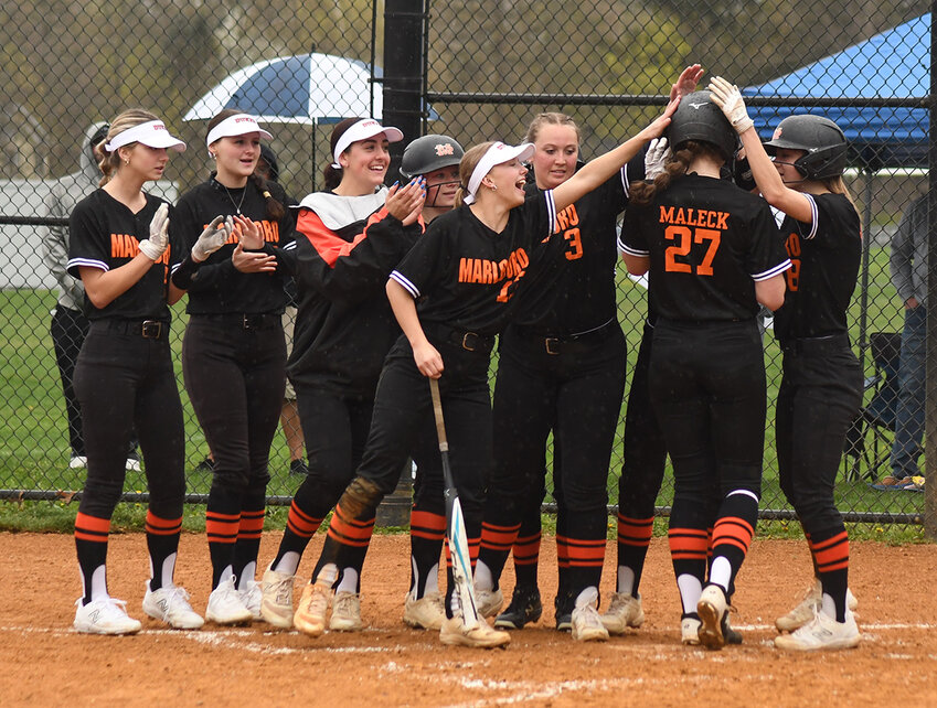 The Marlboro Dukes greet Sam Maleck at home plate after she hits a two-run home run during Wednesday’s non-league softball game at Wallkill High School. The Dukes routed the Panthers.