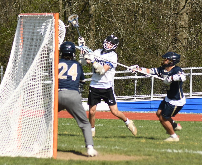 Valley Central’s Brody Jurman takes a shot on goal as Newburgh’s Hiro Miraoka defends  and goalkeeper Dylan Myers waits for the shot during Wednesday’s Division I boys’ lacrosse game at Valley Central High School in Montgomery.