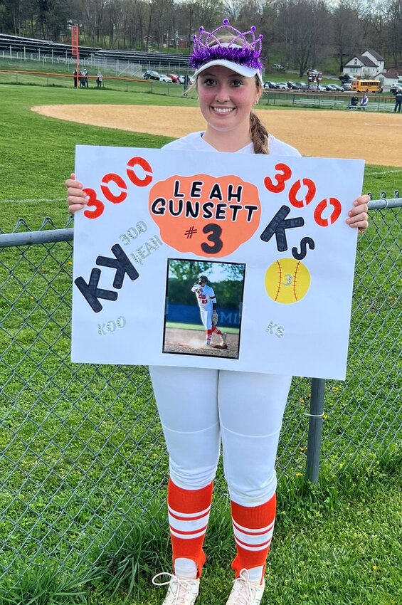 Marlboro’s Leah Gunsett is shown with a sign celebrating her 300th strikeout on Wednesday at Marlboro High School.
