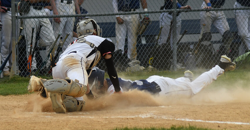 Marlboro catcher Justin Piscopo tags out Beacon&rsquo;s Tyhe Elias at home plate during Saturday&rsquo;s Beacon tournament baseball game at Beacon High School.