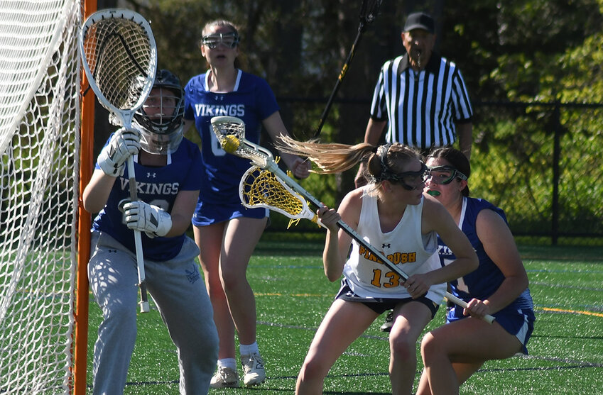 Pine Bush’s Sam Budney maneuvers around the goal as Valley Central’s Natalie Benincasa defends and Chloe Santangelo and goalkeeper Madison Roszkowski look on during Thursday’s Division I girls’ lacrosse game at Pine Bush High School’s Alumni Field.