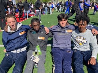 The Newburgh Free Academy boys’ 3,200-meter relay team of Devin Batelic, Kendy Georges, Brady Danyluk and David Pinnock is shown at the Penn Relays on April 26 after setting a new school record with a time of 7:45.54.