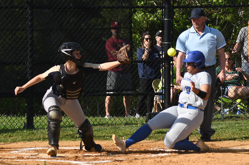 Middletown&rsquo;s Alana Ramirez slides into home as Newburgh catcher Melissa Schulze waits for the throw during Wednesday&rsquo;s OCIAA Division I softball game at NFA North.