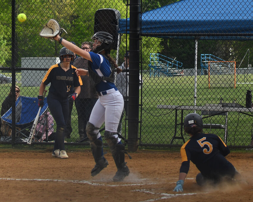Highland’s Ciara Teamer scores as Wallkill catcher Gianna Allessandro takes the throw during Thursday’s non-league softball game at Wallkill Senior High School.