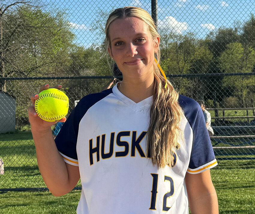 Highland pitcher Alexa Pavese is shown with the game ball after recording her 400th career strikeout on May 1 at Highland High School.