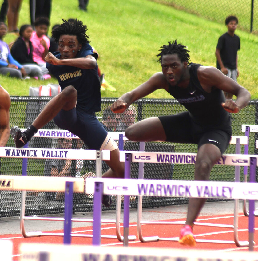 Newburgh&rsquo;s Giwenn Eloge, left, trails Monticello&rsquo;s Tahir Denton in the 110-meter hurdles during Friday&rsquo;s OCIAA track and field championships at Warwick Valley High School.