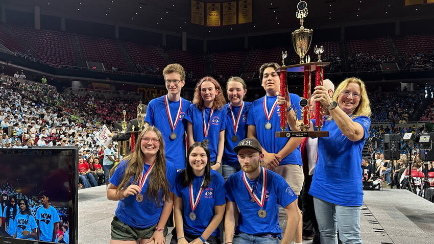The Pine Bush High School Odyssey of the Mind team, with their second-place trophy at Iowa State University.