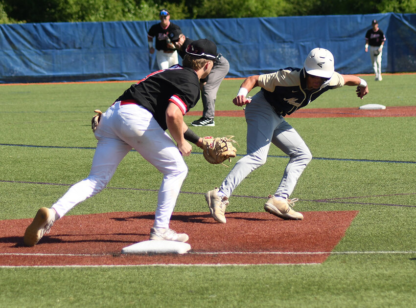 Newburgh&rsquo;s Joe Santo changes direction as Ketcham first baseman Ryan Mealy looks to tag him during Saturday&rsquo;s NYSPHSAA Class AAA regional baseball game at SUNY Purchase.