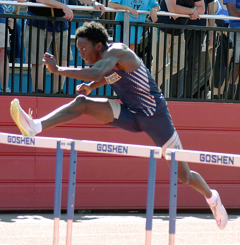 Newburgh&rsquo;s Anthony Barrett clears a hurdle during Friday&rsquo;s Section 9 state qualifier track and field meet at Goshen High School.