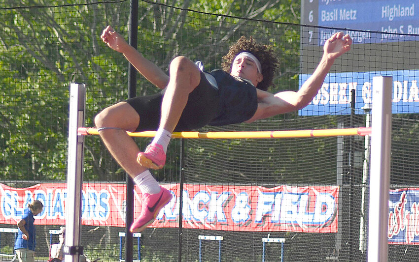 Pine Bush&rsquo;s Alexander Russo clears the bar in the boys&rsquo; high jump during Friday&rsquo;s Section 9 state qualifier track and field meet at Goshen High School.