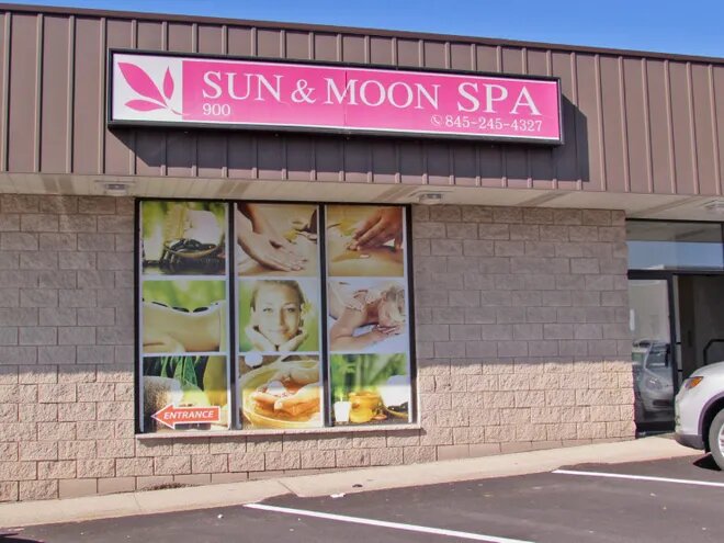 Investigation into activities at two New Windsor massage parlors has led to two arrests.