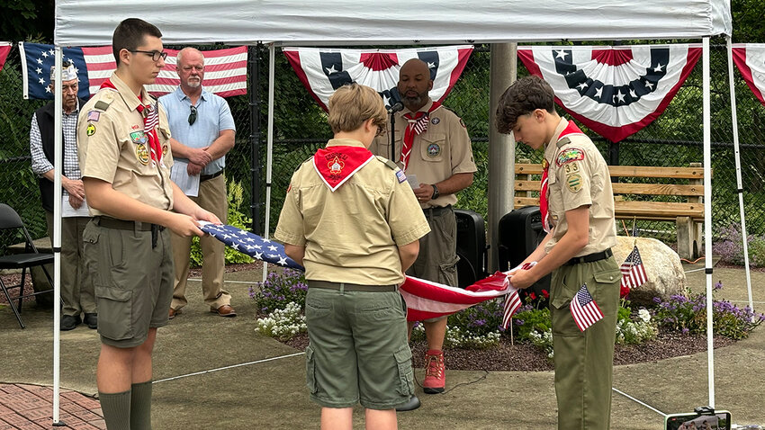 Boy Scout Troop 33 demonstrating a flag-folding procedure during Sunday’s Flag Day ceremony in Walden.