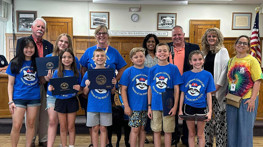 The town board poses with Montgomery Elementary’s Odyssey of the Mind team and County Legislator Ronald Feller.