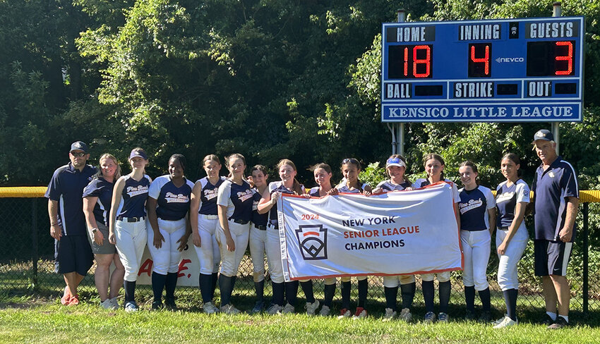 The Pine Bush Senior softball team poses with the New York State Senior League championship banner on Wednesday at Virginia Road Field in White Plains.