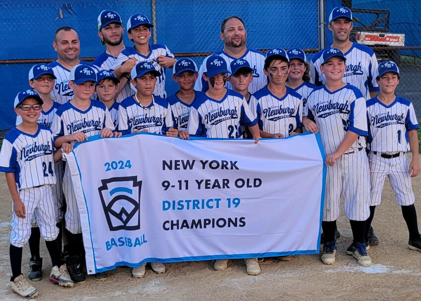 The Town of Newburgh 11U baseball team poses with the District 19 11U championship banner on July 8 at the Town of Newburgh Little League Complex.