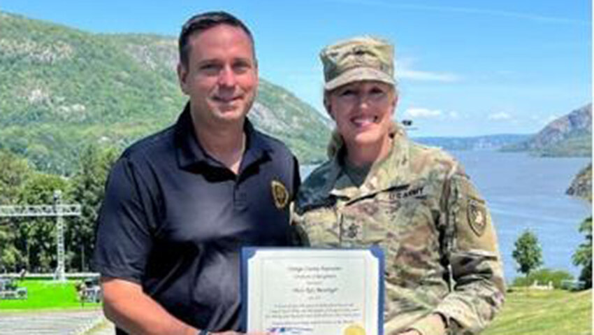 Orange County Executive Steve Neuhaus with Sgt. Maj. MaryKay Messenger, acclaimed vocalist who is retiring from the U.S. Army.