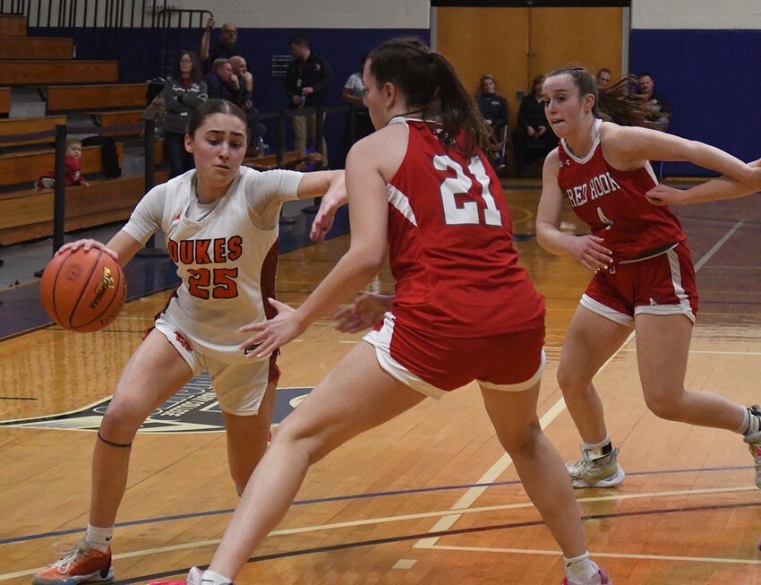 Marlboro&rsquo;s Gabby Murphy dribbles as Red Hook&rsquo;s Emilie Kent (21) defends and Katie Boyd looks on during a Section 9 Class A championship girls&rsquo; basketball game on March 1 at Mount St. Mary College in Newburgh.