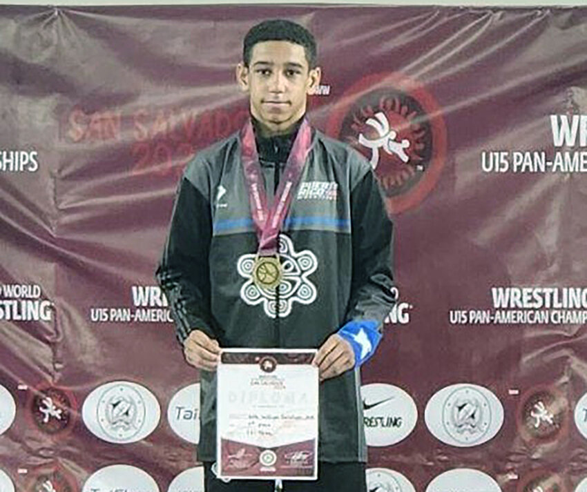 Newburgh’s Will Soto stands atop the podium with his gold medal in the freestyle portion of the U15 Pan-American Games on June 16 in San Salvador, El Salvador.