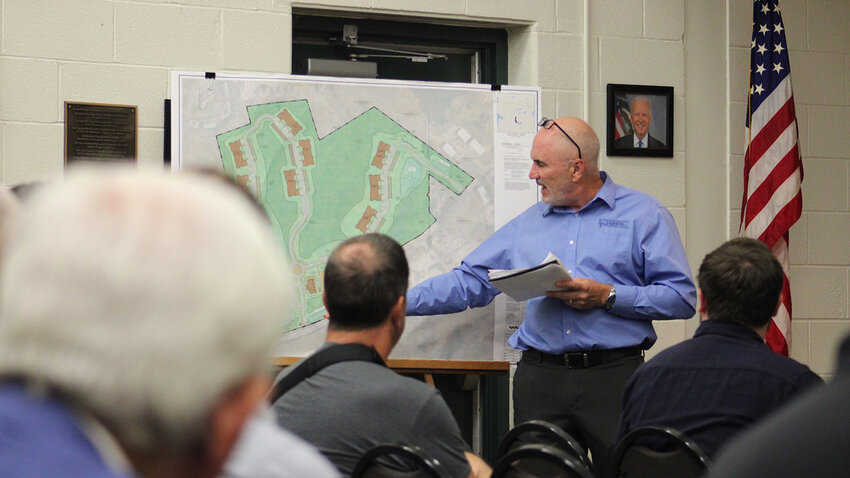 Engineer Ross Winglovitz of Engineering and Surveying Properties discussed the site plan and project with members of the public at a public hearing on August 1.