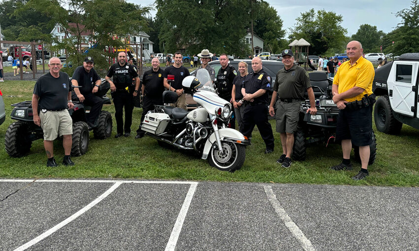 Shawangunk PBA officers, Plattekill Officers and State Troopers together next to their vehicles.