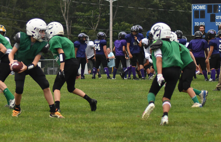 The Cornwall Dragons run an offensive play during Saturday’s Orange County Youth Football League Division 2 scrimmage at Lasser Park in Salisbury Mills.