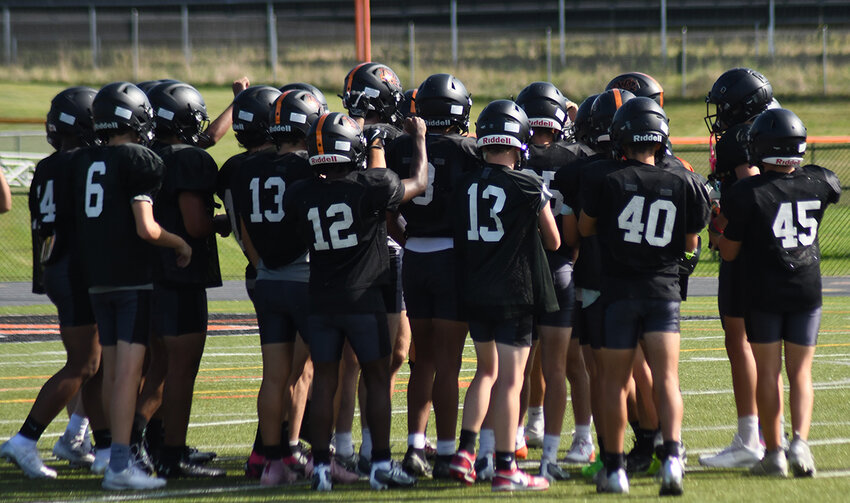 The Marlboro Iron Dukes assemble before Friday’s football practice at Marlboro High School.